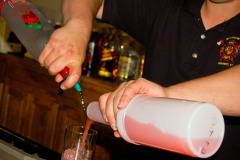 Bartender mixing drinks